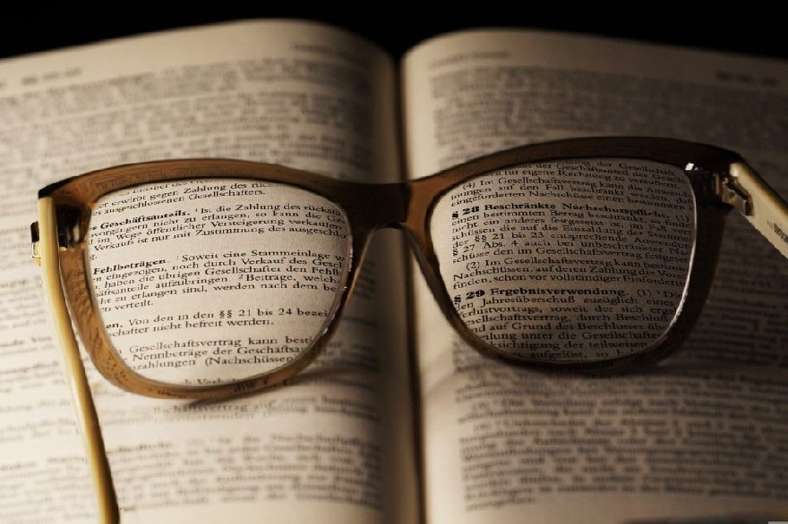 A book and glasses