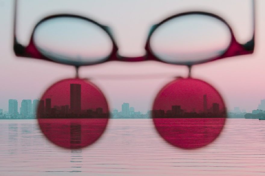 Sunglasses over a lake